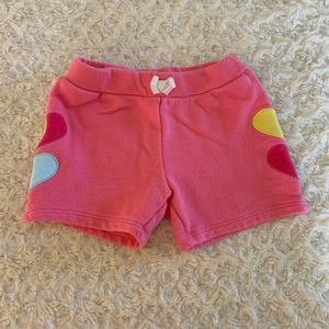 Pink shorts with heart detail on each side